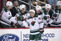 Minnesota Wild's Jared Spurgeon (46) returns to the bench after scoring during the second period of an NHL hockey game against the Pittsburgh Penguins in Pittsburgh, Saturday, Nov. 6, 2021. (AP Photo/Gene J. Puskar)