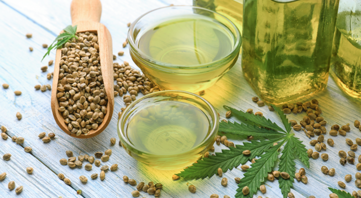 Composition with hemp oil in bowls on table