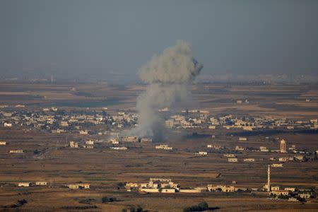 Smoke following an explosion in Syria is seen from the Israeli-occupied Golan Heights near the Israeli Syrian border July 16, 2018. REUTERS/Ronen Zvulun