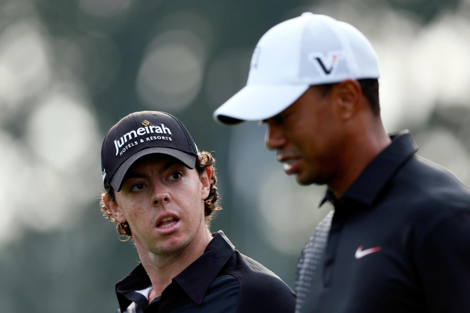 FARMINGDALE, NY - AUGUST 23: (L-R) Rory McIlroy of Northern Ireland and Tiger Woods talk as they walk down the 10th hole during the First Round of The Barclays on the Black Course at Bethpage State Park August 23, 2012 in Farmingdale, New York. (Photo by Kevin C. Cox/Getty Images)