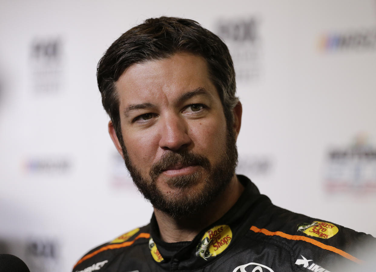 Martin Truex Jr. during media day for the NASCAR Daytona 500 auto race at Daytona International Speedway, Wednesday, Feb. 14, 2018, in Daytona Beach, Fla. (AP Photo/Terry Renna)