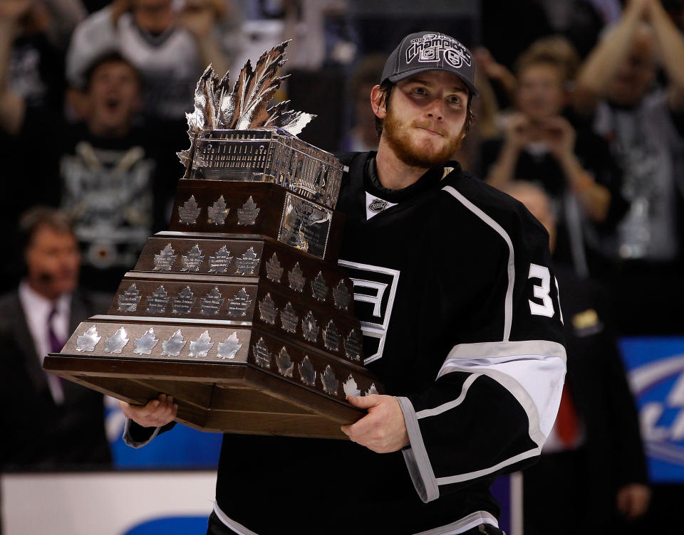 LOS ANGELES, CA - JUNE 11: Goaltender Jonathan Quick #32 of the Los Angeles Kings holds the Conne Smythe Trophy for the Most Valuable Player in the NHL Playoffs after the Los Angeles Kings defeated the New Jersey Devils 6-1 in Game Six to win the series 4-2 of the 2012 Stanley Cup Final at Staples Center on June 11, 2012 in Los Angeles, California. (Photo by Bruce Bennett/Getty Images)