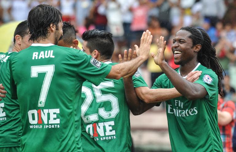 The New York Cosmos' Lucky Mkosana (R) celebrates scoring a goal with teammate Raul Gonzalez, during their friendly match against Cuba, at Pedro Marrero stadium in Havana, on June 2, 2015