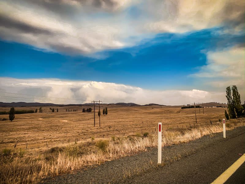 Fire clouds are formed over the mountains' range near Bredbo