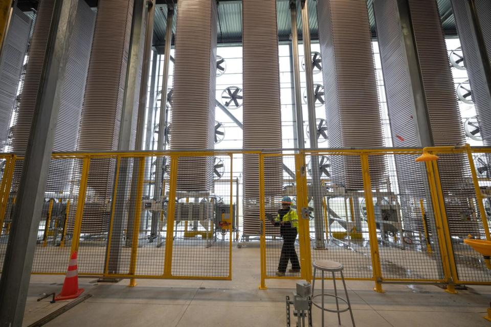 Towering structures of fans and trays that capture carbon dioxide