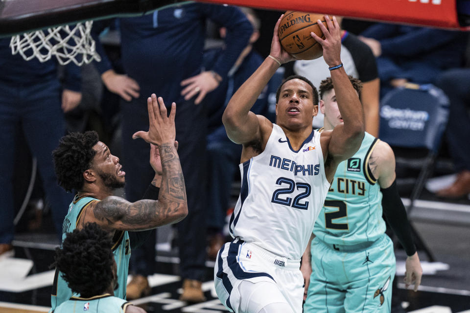Memphis Grizzlies guard Desmond Bane (22) shoots the ball in front of Charlotte Hornets forward Miles Bridges, left, during the second half of an NBA basketball game in Charlotte, N.C., Friday, Jan. 1, 2021. (AP Photo/Jacob Kupferman)