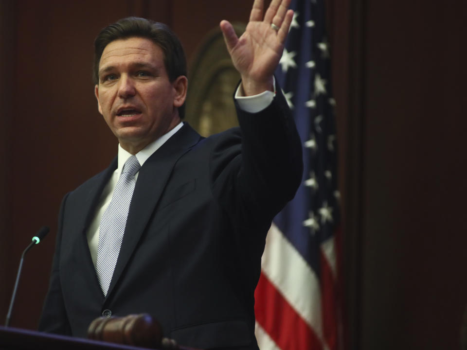 Florida Ron DeSantis waves as he gives his State of the State address during a joint session of the Senate and House of Representatives Tuesday, March 7, 2023 at the Capitol in Tallahassee, Fla. (AP Photo/Phil Sears)