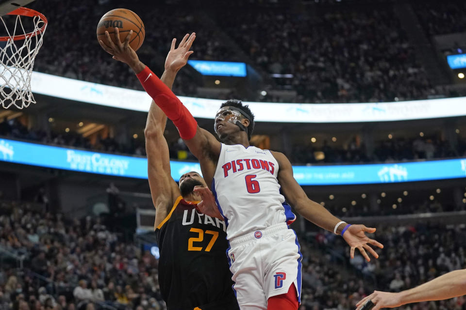 Detroit Pistons guard Hamidou Diallo (6) goes to the basket as Utah Jazz center Rudy Gobert (27) defends in the first half during an NBA basketball game Friday, Jan. 21, 2022, in Salt Lake City. (AP Photo/Rick Bowmer)