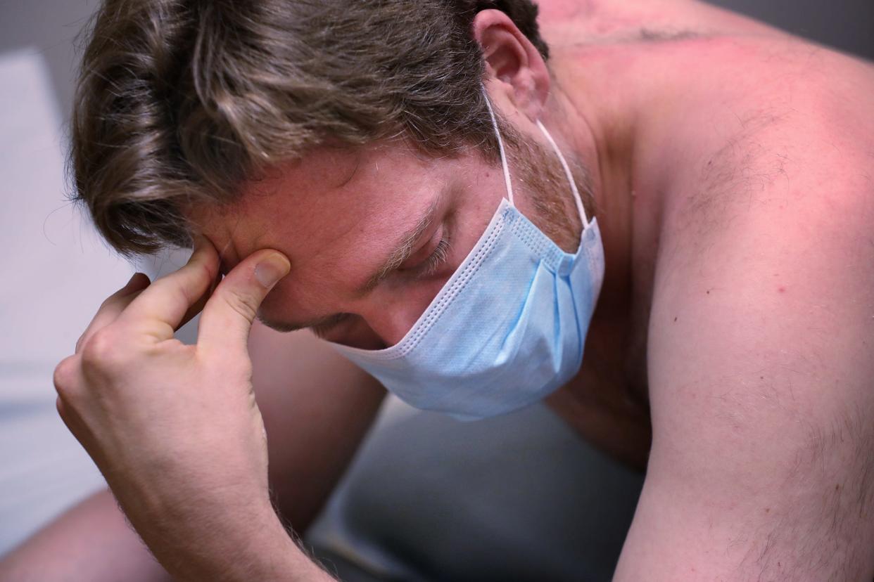 Adam Bodony rests during physical therapy Aug. 17, 2021, at IU Health North Hospital. He developed persistent symptoms after a bout with COVID-19 in 2020.