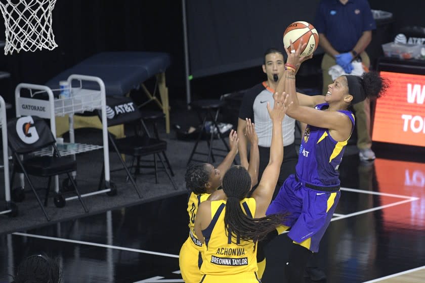 Sparks forward Candace Parkergoes u p for a shot in front of Indiana's Kelsey Mitchell (0) and Natalie Achonwa (11).