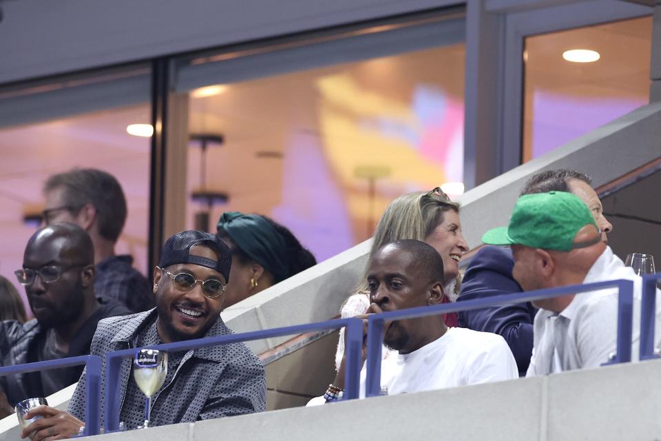 NEW YORK, NEW YORK - AUGUST 29: Former professional basketball player Carmelo Anthony (L) looks on during the Women's Singles Second Round match between Naomi Osaka of Japan and Karolina Muchova of Czech Republic on Day Four of the 2024 US Open at USTA Billie Jean King National Tennis Center on August 29, 2024 in the Flushing neighborhood of the Queens borough of New York City. (Photo by Luke Hales/Getty Images) ORG XMIT: 776152829 ORIG FILE ID: 2169358921