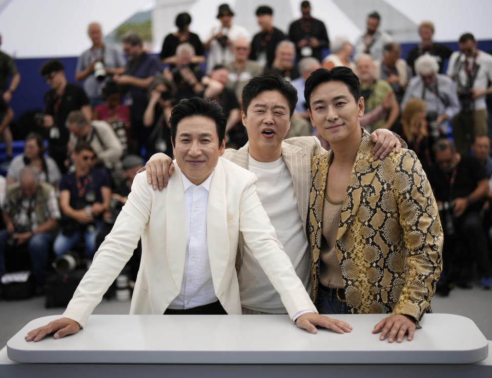 FILE - Lee Sun-kyun, from left, Kim Hee-won and Ju Ji-hoon poses for photographers at the photo call for the film 'Project Silence' at the 76th international film festival, Cannes, southern France, on May 22, 2023. Police says actor Lee Sun-kyun of the Oscar-winning “Parasite” has been found unconscious. Seoul police said police officers discovered an unconscious Lee at an unidentified Seoul site on Wednesday, Dec. 27, but gave no further details. (AP Photo/Daniel Cole, File)