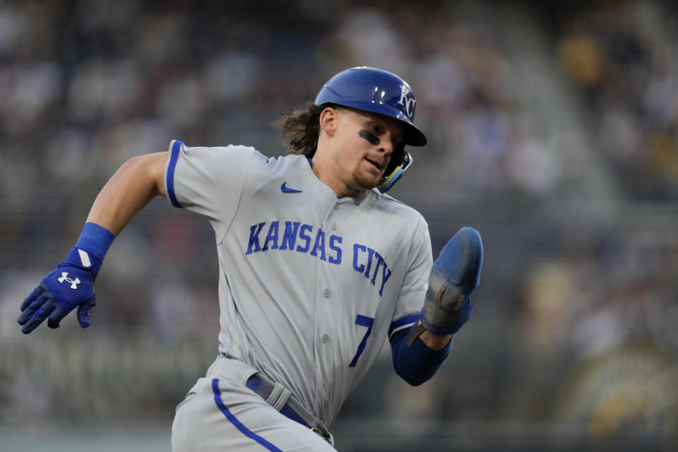 Kansas City Royals' Bobby Witt Jr. rounds third base, on his way to scoring from first off a two-RBI double by Salvador Perez during the second inning of a baseball game against the San Diego Padres, Tuesday, May 16, 2023, in San Diego. (AP Photo/Gregory Bull)