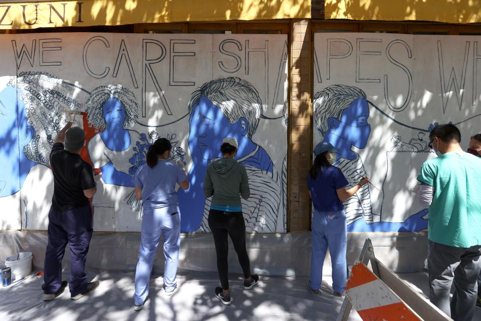 Painting a mural to honor medical workers on June 22, 2020, in San Francisco.