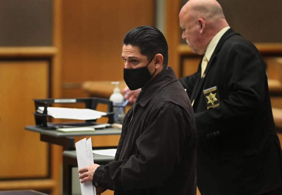 Rape suspect Elias Huizar, 39, of West Richland prepares to leaves a Feb. 15, 2024 hearing in Benton County Superior Court after filling out court paperwork at the Benton County Justice Center in Kennewick. The former Yakima school resource officer faces charges for a sexual relationship with a teen girl and for raping her drunk friend.