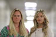 First grade teachers, Ellie Morgan, 25, left, Hannah Sprayberry, 28, right, pose for a portrait, and say they are taking around 5 per-cent pay cut on Thursday, May 28, 2020, in Fort Oglethorpe, Ga. With sharp declines in state spending projected because of the economic fallout from the COVID-19 pandemic, America's more than 13,000 local school systems are wrestling with the likelihood of big budget cuts. (AP Photo/Brynn Anderson)