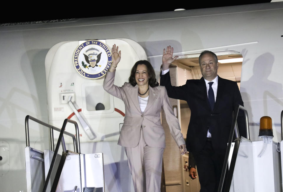 Vice President Kamala Harris and her husband Douglas Emhoff wave as they arrive at the Julius Nyerere Airport in Dar es Salaam, Tanzania, Wednesday, March 29, 2023, the second stop of a three-nation tour of Africa. (Emmanuel Herman/Pool Photo via AP)