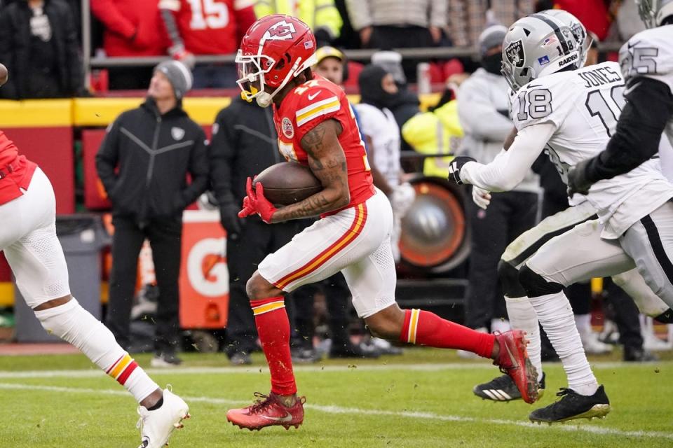 Dec 25, 2023; Kansas City, Missouri, USA; Kansas City Chiefs wide receiver Richie James (17) runs the ball as Las Vegas Raiders cornerback Jack Jones (18) chases during the second half at GEHA Field at Arrowhead Stadium. Mandatory Credit: Denny Medley-USA TODAY Sports