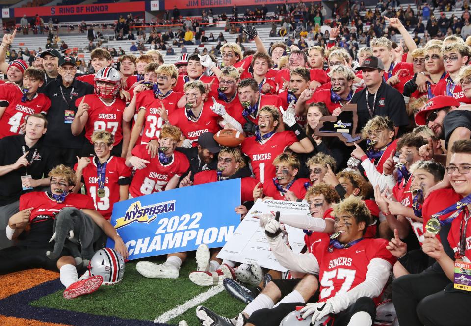 Somers players celebrate after defeating Union-Endicott in the state Class A football championships at JMA Wireless Dome in Syracuse Dec. 3, 2022. 