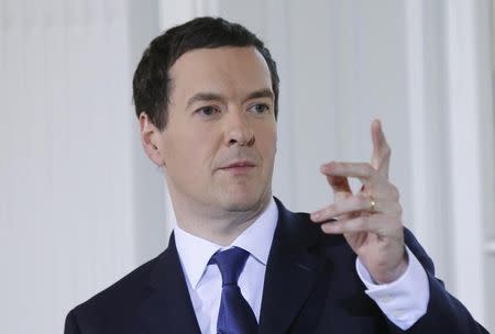 Britain's Chancellor of the Exchequer George Osborne gestures during an election campaign event in London April 7, 2015. REUTERS/Suzanne Plunkett