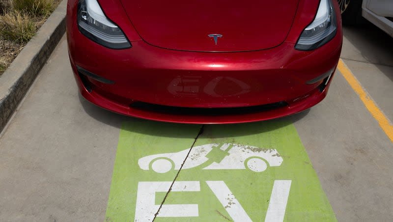 A Tesla is parked at an electric charging station outside of the Utah State Capitol in Salt Lake City on Thursday, May 2, 2024.