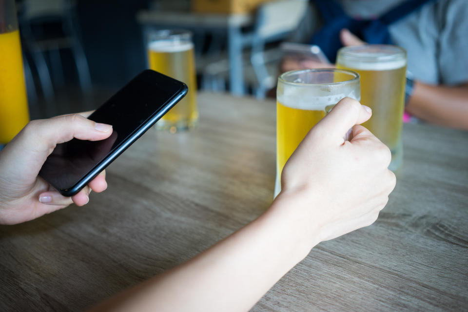 <em>A pub chain is reportedly banning customers from using mobile phones in its pubs (Picture: Getty)</em>