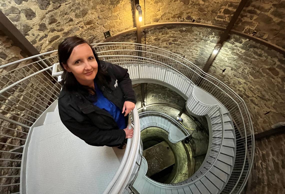 Greensburg City Administrator Stacy Barnes stands on the staircase overlooking the Big Well.