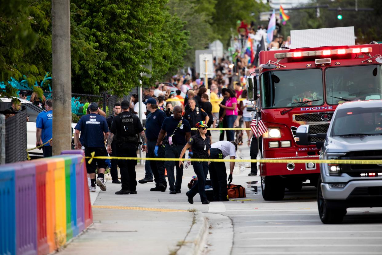 Police and firefighters respond after a truck drove into a crowd of people during The Stonewall Pride Parade and Street Festival in Wilton Manors, Fla., on Saturday, June 19, 2021 (AP)