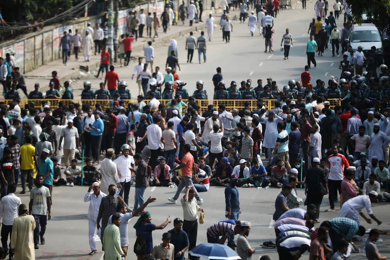 Police put a barricade on the street as Bangladesh Jamaat-e-Islami occupy street of Matijheel to hold a rally in Dhaka