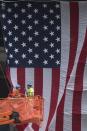 Workers unveil the U.S. flag overlooking the 9/11 Memorial at Ground Zero, the site of the September 11, 2001 attacks, in New York September 10, 2013. Wednesday marks the 12th anniversary of the attacks on September 11, 2001. (REUTERS/Adrees Latif)