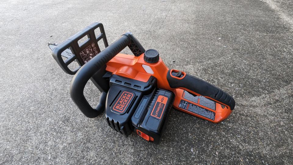 Image showing the back handle and triggers on the BLACK + DECKER 40V MAX 12-inch Cordless Chainsaw