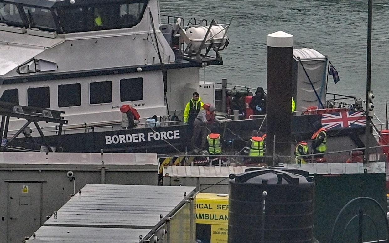 Border Force help bring illegal immigrants, some with very young children, into Dover Docks this morning during bad weather and strong winds - Stuart Brock / Story Picture Agency