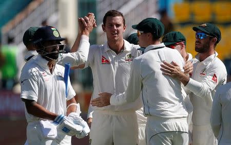 Cricket - India v Australia - Fourth Test cricket match - Himachal Pradesh Cricket Association Stadium, Dharamsala, India - 26/03/17 - Australia's Josh Hazlewood (C-facing the camera) celebrates after dismissing India's Murali Vijay (L) with his teammates. REUTERS/Adnan Abidi