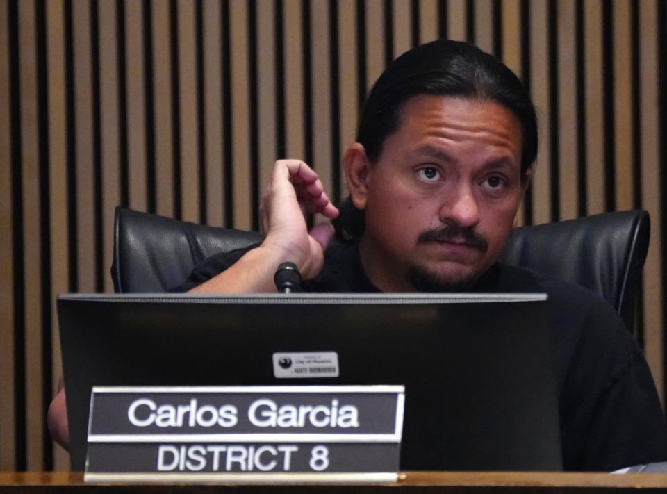 Councilmember Carlos Garcia listens to public comments on issues related to trailer parks and low-income housing during a Phoenix City Council meeting on March 22, 2023.