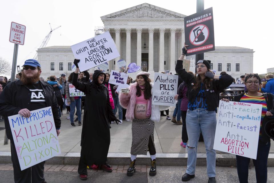 FILE - Anti-Abortion demonstrators protest outside of the Supreme Court during a rally, March 26, 2024, in Washington. The U.S. Supreme Court will hear arguments Wednesday in a case that could determine whether doctors can provide abortions to pregnant women with medical emergencies in states that enact abortion bans. (AP Photo/Jose Luis Magana, File)