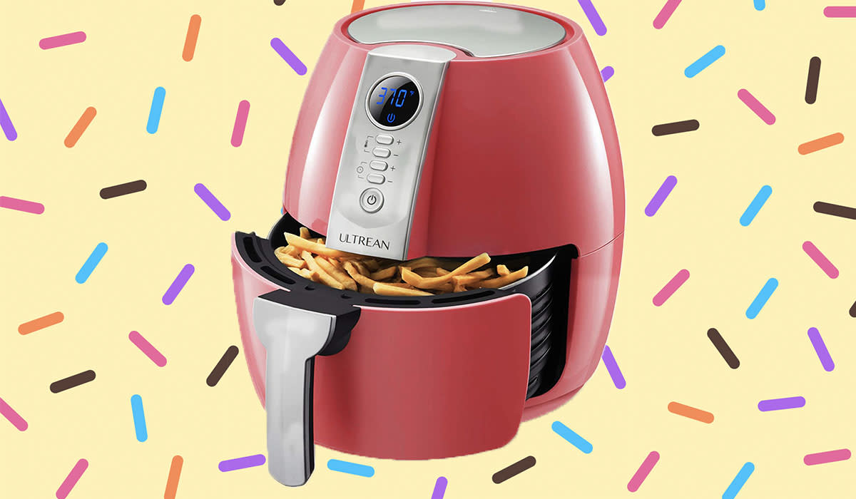 A red air fryer on a sprinkle pattern background