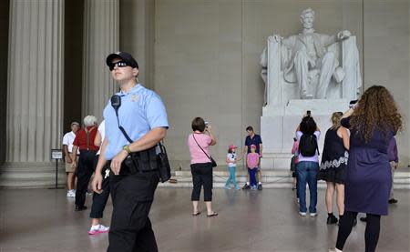 A US Parks Policeman walks among tourists flocking to the Lincoln Memorial, in Washington, September 29, 2013, as a possible government shutdown looms in two days. REUTERS/Mike Theiler