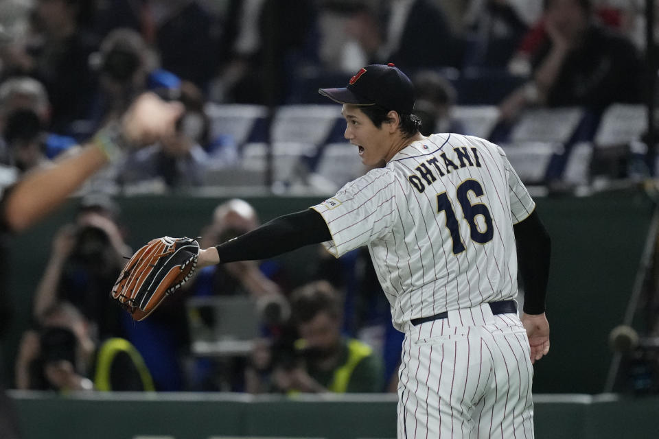 Shohei Ohtani of Japan reacts during the third inning of the quarterfinal game between Italy and Japan at the World Baseball Classic (WBC) at Tokyo Dome in Tokyo, Japan, Thursday, March 16, 2023. (AP Photo/Eugene Hoshiko)