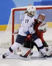 Ice Hockey – Pyeongchang 2018 Winter Olympics – Women Preliminary Round Match - U.S. v Canada - Kwandong Hockey Centre, Gangneung, South Korea – February 15, 2018 - Jocelyne Lamoureux of the U.S. (17) in action with goalkeeper Genevieve Lacasse of Canada. REUTERS/David W Cerny