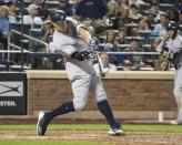 Jun 9, 2018; New York City, NY, USA; New York Yankees right fielder Aaron Judge (99) hits a home run against the New York Mets during the eighth inning of the game at Citi Field. Mandatory Credit: Gregory J. Fisher-USA TODAY Sports