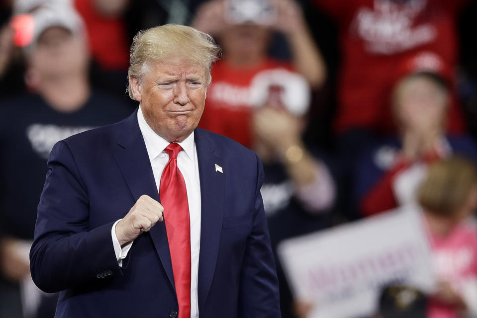 President Donald Trump gestures as he arrives at a campaign rally in Hershey, Pa., Tuesday, Dec. 10, 2019. (AP Photo/Matt Rourke)
