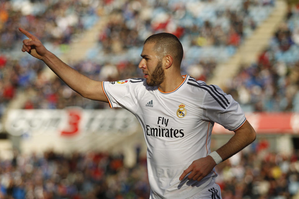 Real's Karim Benzema celebrates his goal during a Spanish La Liga soccer match between Real Madrid and Getafe at the Coliseum Alfonso Perez stadium in Madrid, Spain, Sunday, Feb. 16, 2014. (AP Photo/Gabriel Pecot)