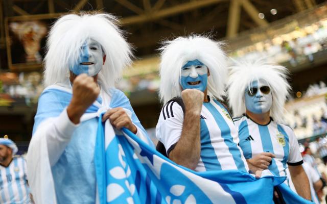 Argentina fans wear face paint inside the stadium before the match - Hannah Mckay/Reuters