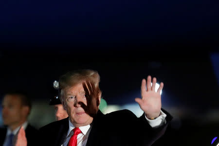 U.S. President Donald Trump waves as he arrive at Joint Base Andrews, after a trip to Ohio, in Maryland, U.S., March 20, 2019. REUTERS/Carlos Barria