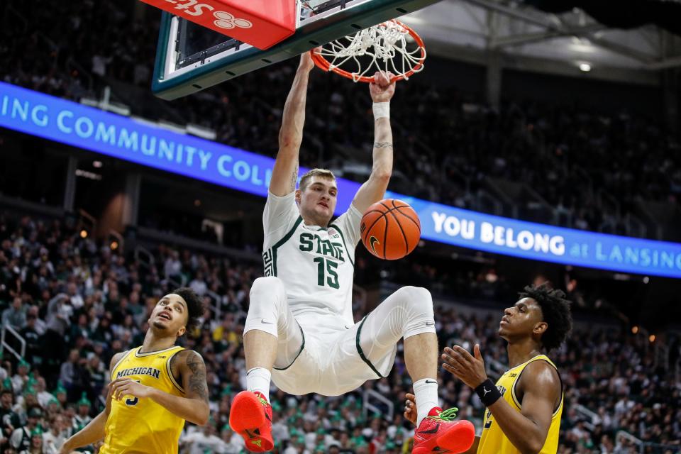 Michigan State center Carson Cooper (15) dunks against Michigan during the second half of MSU's 81-62 win over Michigan on Tuesday, Jan. 30, 2024, in East Lansing.