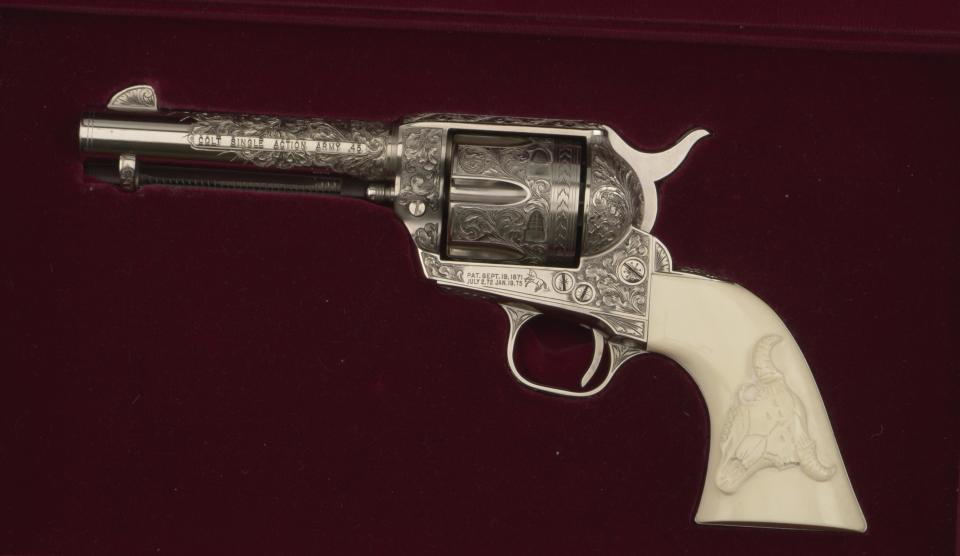 This undated photo provided by the Buffalo Bill Center of the West in Cody, Wyo., shows the Colt .45 single-action revolver used by actor John Hart in the original “The Lone Ranger” television series, which ran from 1952-1954. The museum has acquired the pistol made famous by the masked hero of television from more than 60 years ago. The revolver is now on display at the Buffalo Bill Center of the West, in Cody. Hart used several firearms over his acting career, but this gun is special. It features ivory grips and intricate engraving. (AP Photo/Buffalo Bill Center of the West)