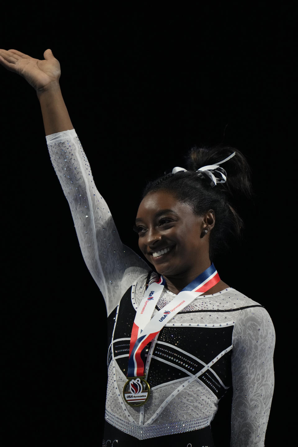 Simone Biles celebrates after winning all-around at the U.S. Classic gymnastics competition Saturday, Aug. 5, 2023, in Hoffman Estates, Ill. (AP Photo/Erin Hooley)