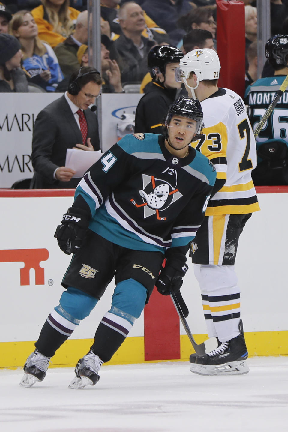 Anaheim Ducks' Kiefer Sherwood (64) skates past Pittsburgh Penguins' Jack Johnson (73) as he heads to the bench after Sherwood scored during the second period of an NHL hockey game, Monday, Dec. 17, 2018, in Pittsburgh. (AP Photo/Keith Srakocic)