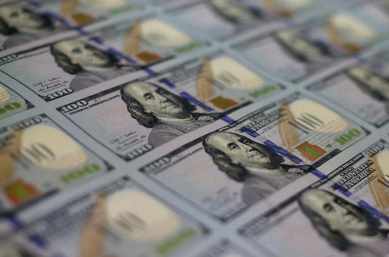 US dollar was trading at 124.08 yen, slightly down from 124.12 yen in New York on Friday