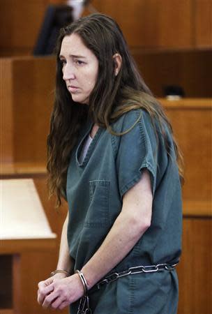 Megan Huntsman, accused of killing six of her babies and storing their bodies in her garage, appears in court in Provo, Utah, April 28, 2014. REUTERS/Rick Bowmer/Pool